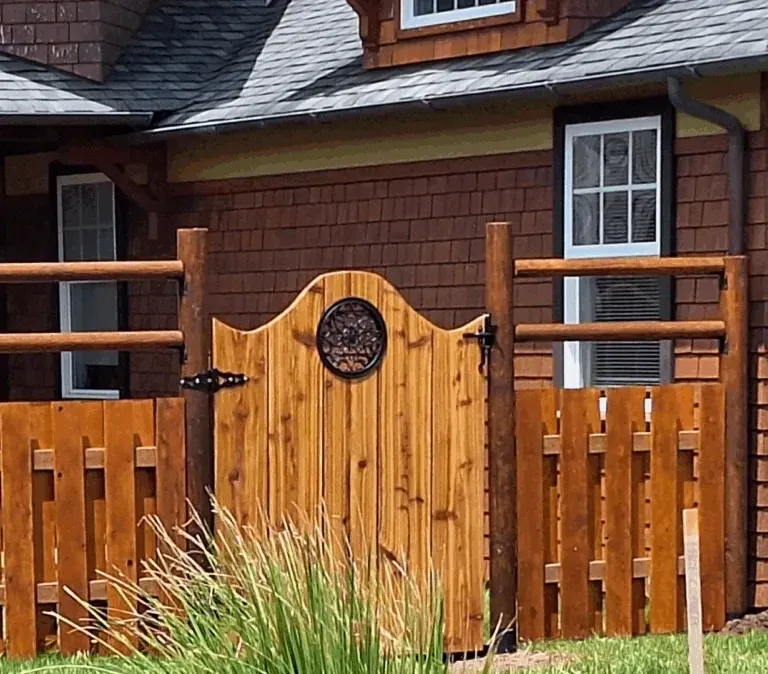 Custom arched cedar gate built by SeaBreeze