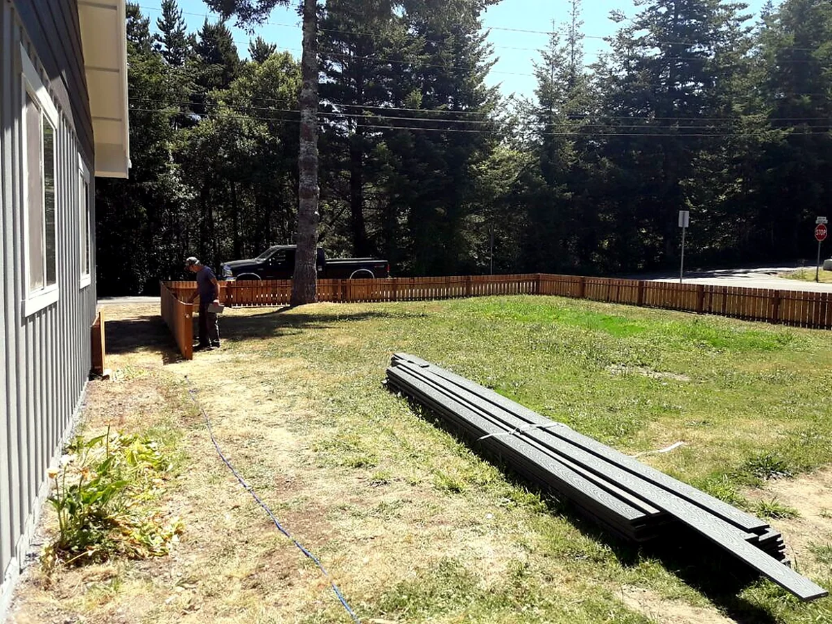 Wood fence installed by SeaBreeze on a Bandon property