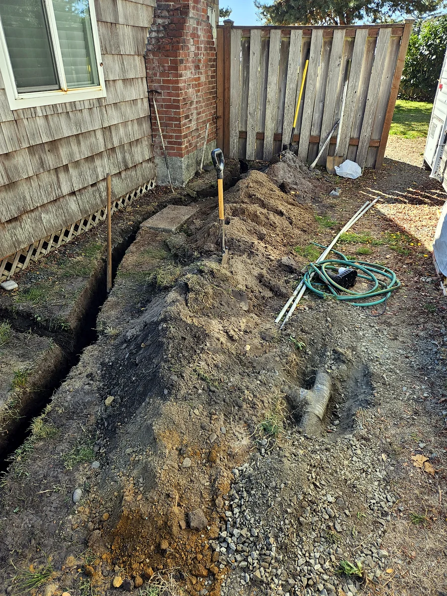 Drainage trench dug along a foundation by SeaBreeze