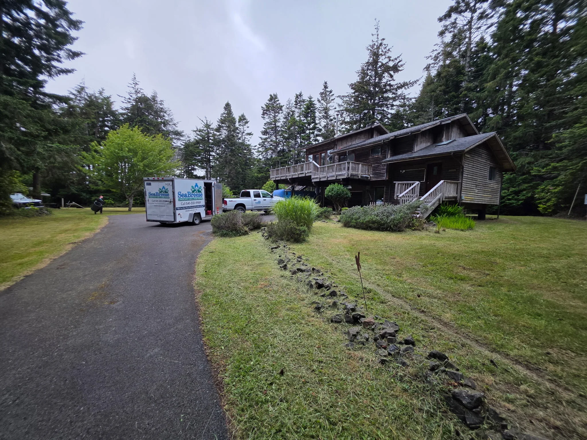 The same driveway mowed and cleared by SeaBreeze with the crew trailer on site