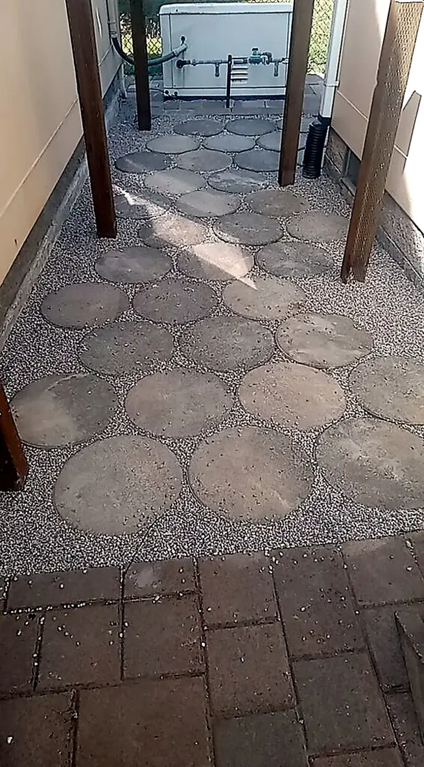 Round paver path set into gravel, hardscape by SeaBreeze